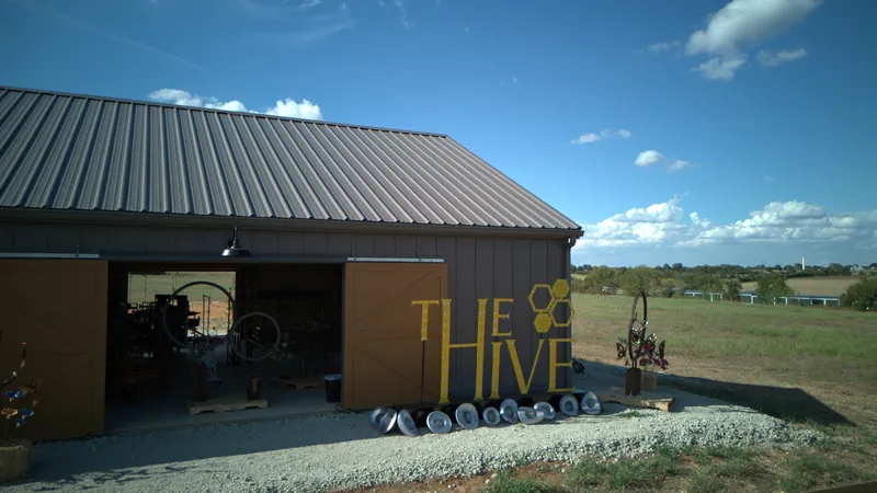 The Hive barn entrance and yellow sign