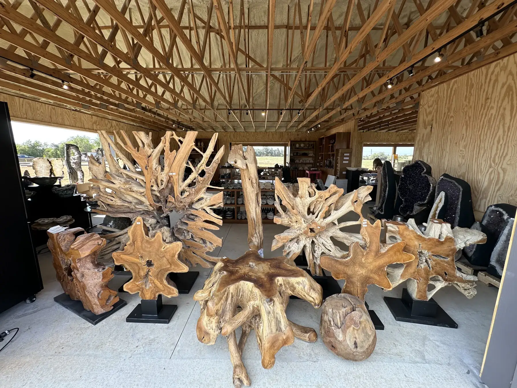 Sculptural wood and mineral pieces displayed inside The Hive