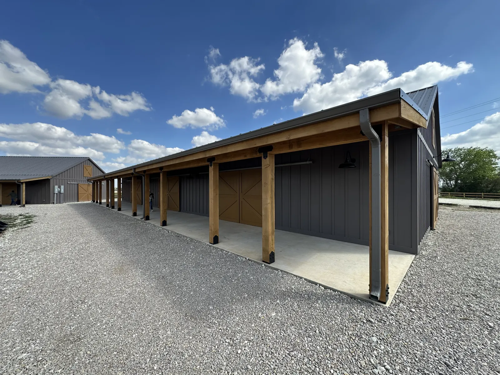 Covered open-air porches and timber columns at The Hive
